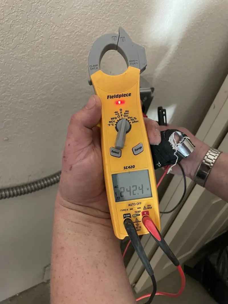Voltage testing with clamp meter during Recessed Lighting Installation in Lake Barrington